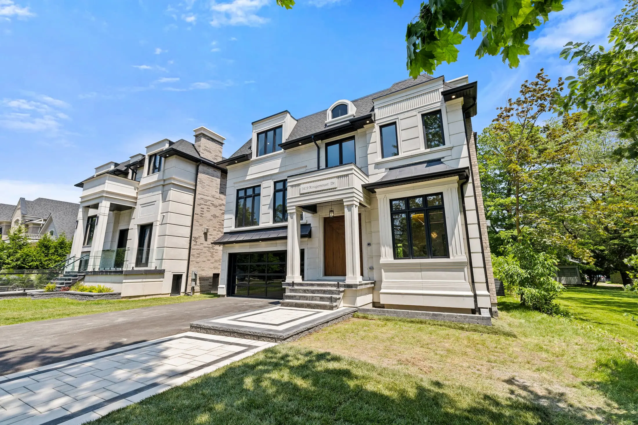 Luxury custom home real estate photography portfolio sample featuring stone masonry and clean landscape design in Pickering.