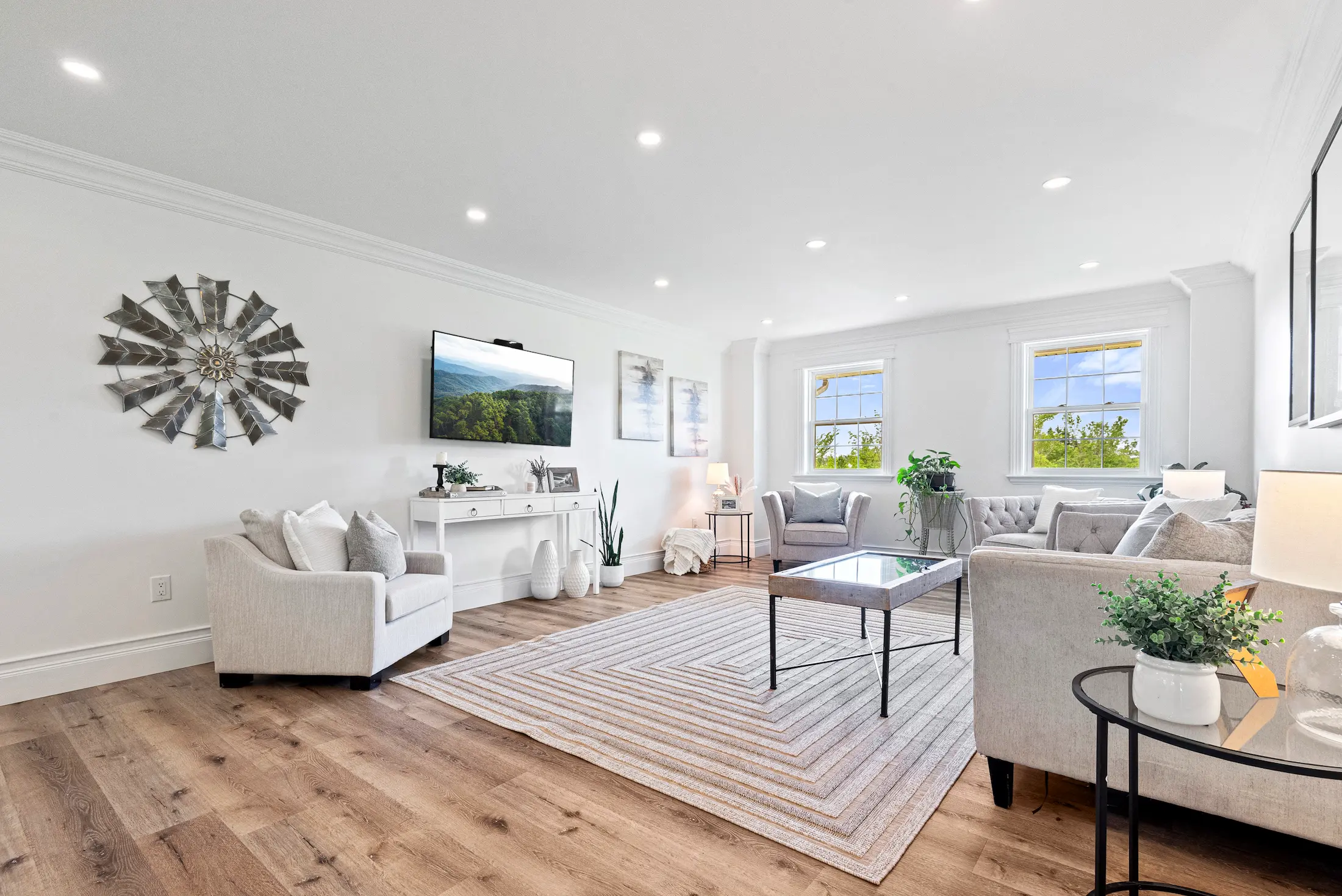 Professional interior real estate photography of a spacious, bright luxury living room in a custom Selwyn home.