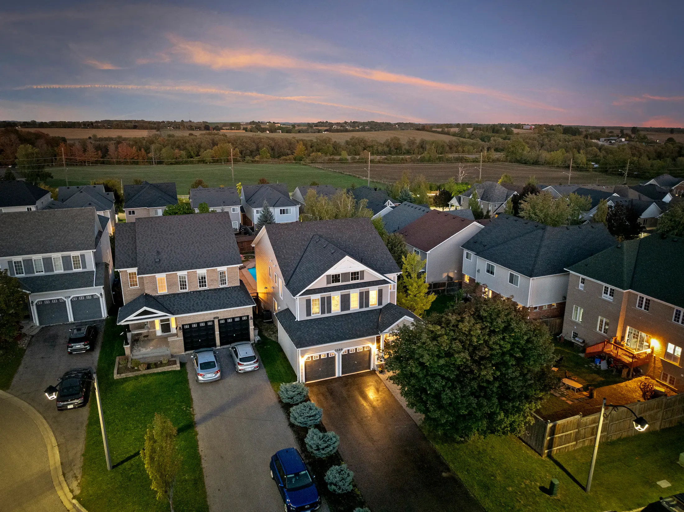 Stunning evening aerial shot of a suburban home in Oshawa, an example of our premium real estate photography Oshawa services.